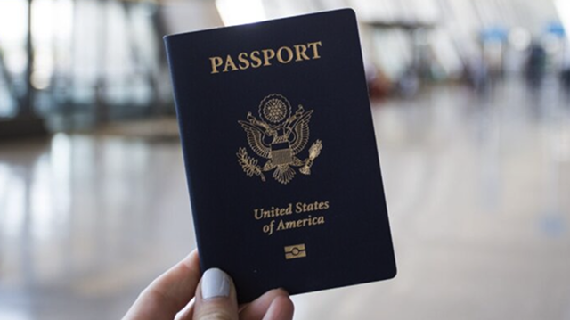 Dark blue passport book with the seal of the United States.