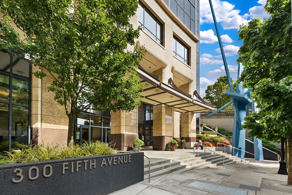 Exterior of Seattle Passport Agency office building. There is a modern art sculpture to the right of the entrance.